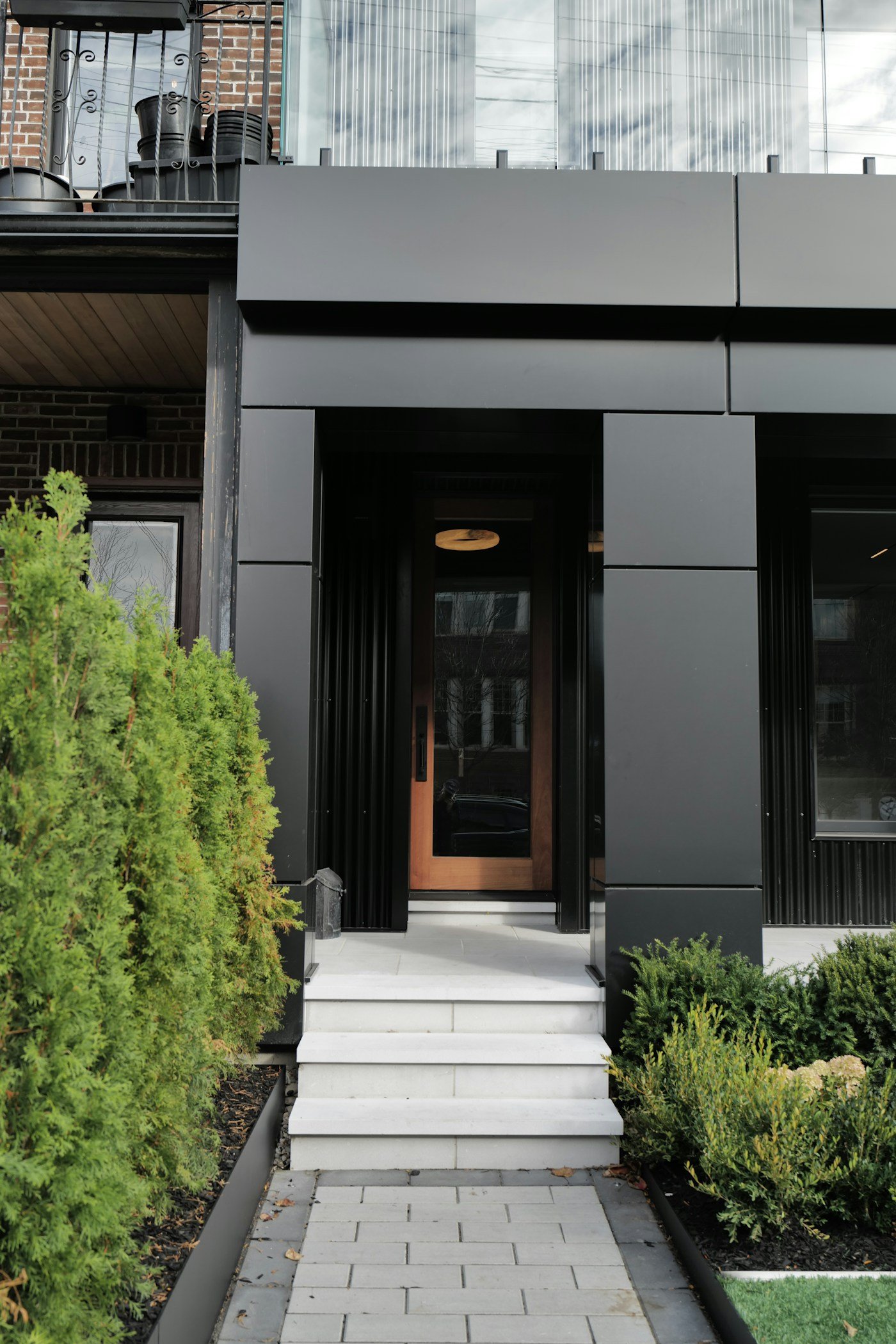 Contemporary front entry door system by Cantera Doors and ESW